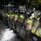 Choques entre manifestantes y policías en Venezuela.-AFP / JUAN BARRETO