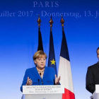 La cancillera alemana Angela Merkel y el presidente de Francia Emmanuel Macron.-Markus Schreiber