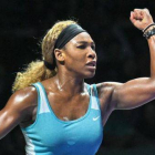 Serena Williams celebra un punto en su partido de semifinales contra Wozniacki.-Foto: AFP / ROSLAN RAHMAN