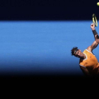 Rafael Nadal, sirviendo en Australia.-AP / AARON FAVILA