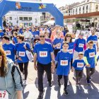 Cientos de personas a la carrera o caminando por el centro de Soria