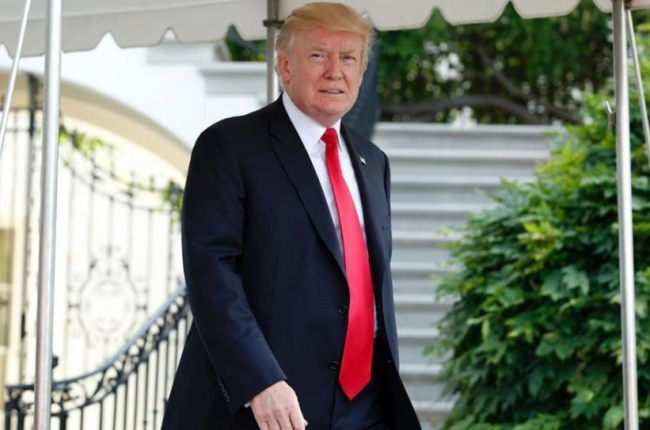 Donald Trump a las puertas de la Casa Blanca.-AFP