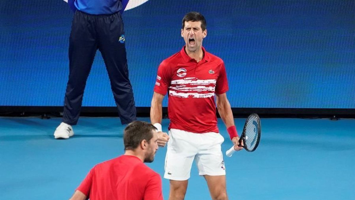 Novak Djokovic y Viktor Troicki celebran un punto antes Pablo Carreno y Feliciano Lopez.-EFE / EPA /MARK EVANS