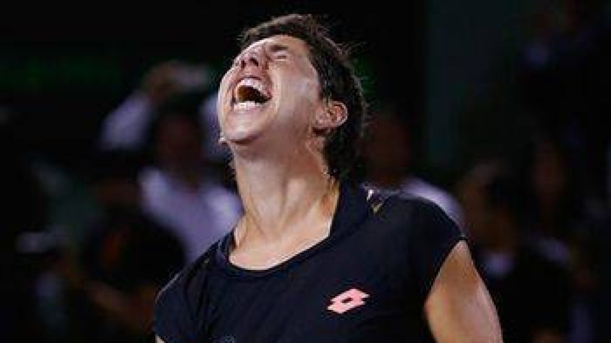 Carla Suárez, eufórica tras batir a Venus Williams en cuartos de final del torneo de Miami.-Foto: AFP / AL BELLO
