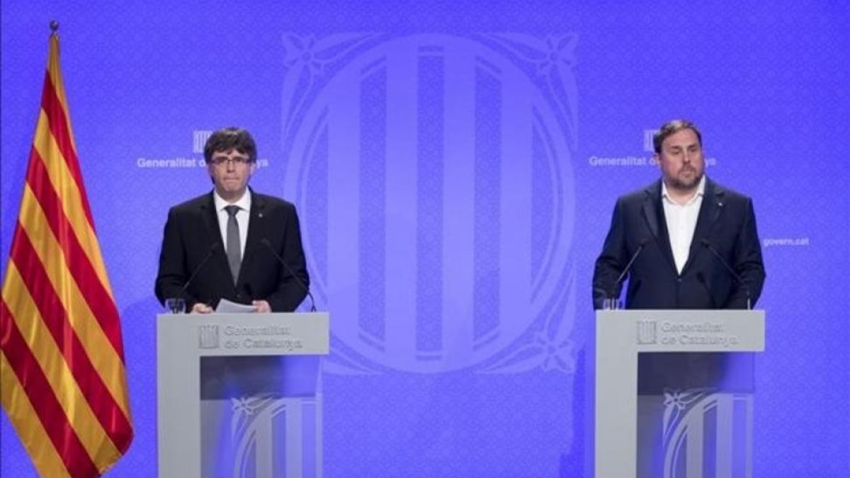 Carles Puigdemont y Oriol Junqueras.-FERRAN NADEU