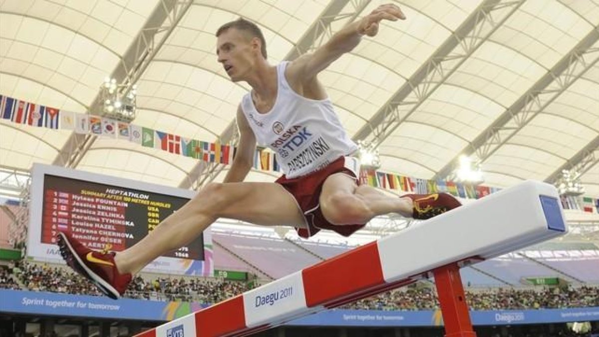 El atleta polaco Lukasz Parszczynski.-AFP / PETER PARKS
