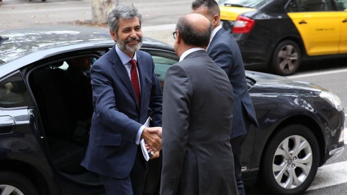 El presidente del CGPJ, Carlos Lesmes, a su llegada al TSJC, este viernes-RICARD CUGAT