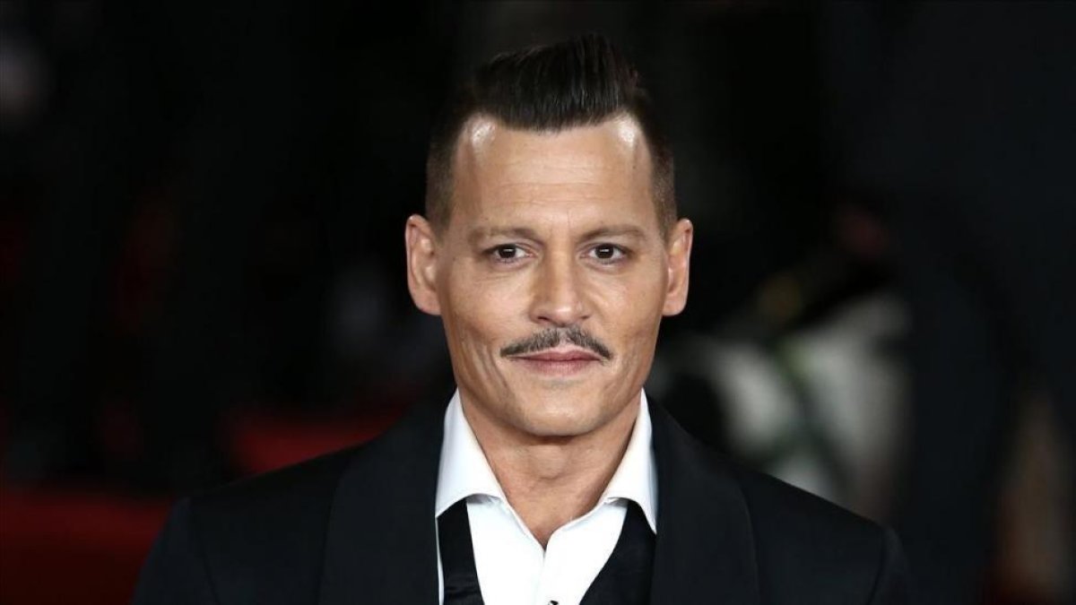 Johnny Depp en la presentación de su última película Asesinato en el Orient Express-EFE / NEIL HALL