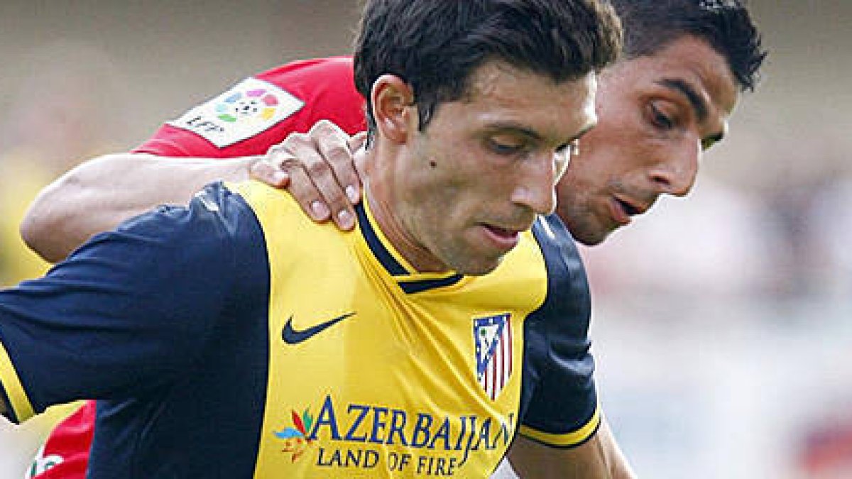 El canterano del Atlético durante un partido con el primer equipo. -