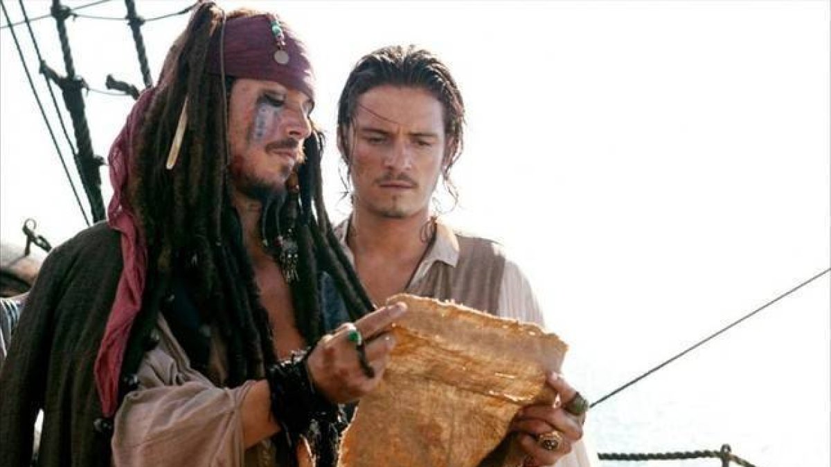Johnny Depp y Orlando Bloom protagonizan la segunda entrega de 'Piratas del caribe' .-