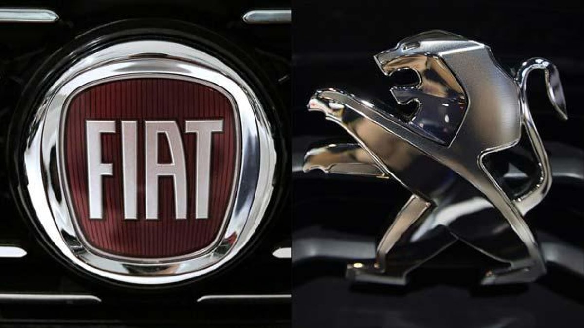 Fiat Chrysler y Peugeot-Citroën aprueban su acuerdo de fusión. En el vídeo, el momento de la firma por parte de directivos de ambos grupos.-M. BERTORELLO / J. SAGET / AFP