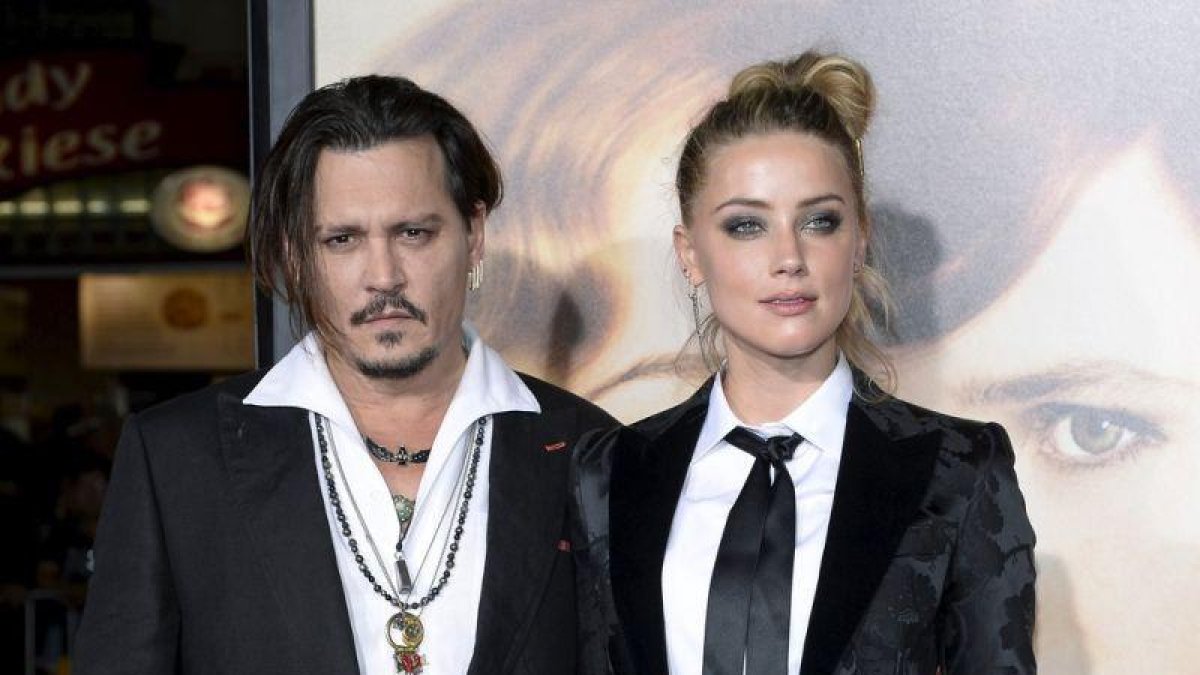 Johnny Depp y Amber Heard durante una premiere en Los Ángeles.-KEVORK DJANSEZIAN / REUTERS