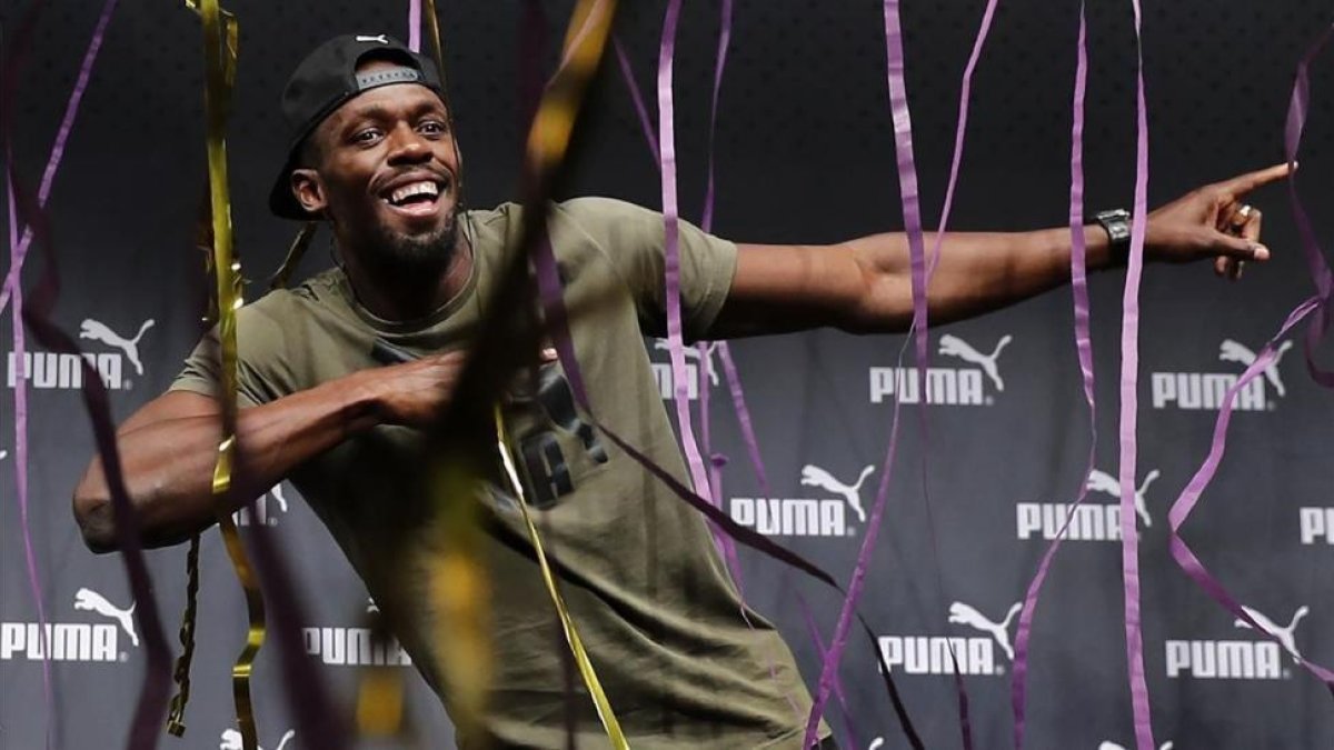 Bolt, en un acto promocional, este martes en Londres.-AFP / ADRIAN DENNIS