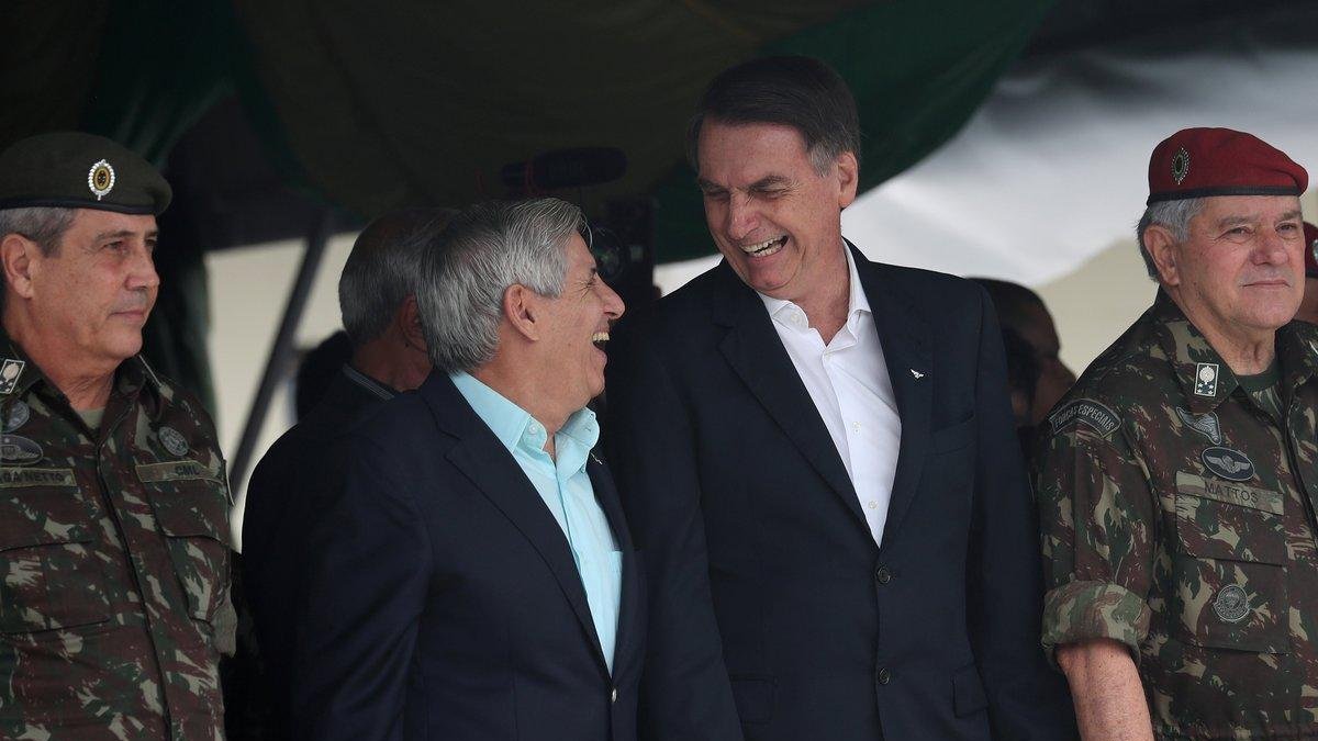 Brazil s President-elect Jair Bolsonaro waves at supporters as he arrives to watch an aerial performance by the private pilots  group a  Esquadrilha do Ceu  or a  Sky Squadron   at Barra beach in Rio de Janeiro  Brazil .-Leo Correa  / AP