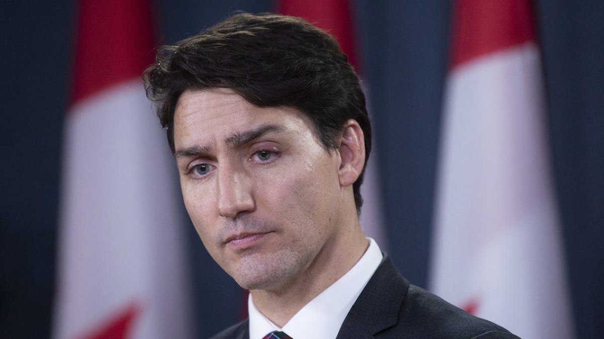 Canadian Prime Minister Justin Trudeau listens to a question during an end of session news conference in Ottawa-CANADIAN PRESS
