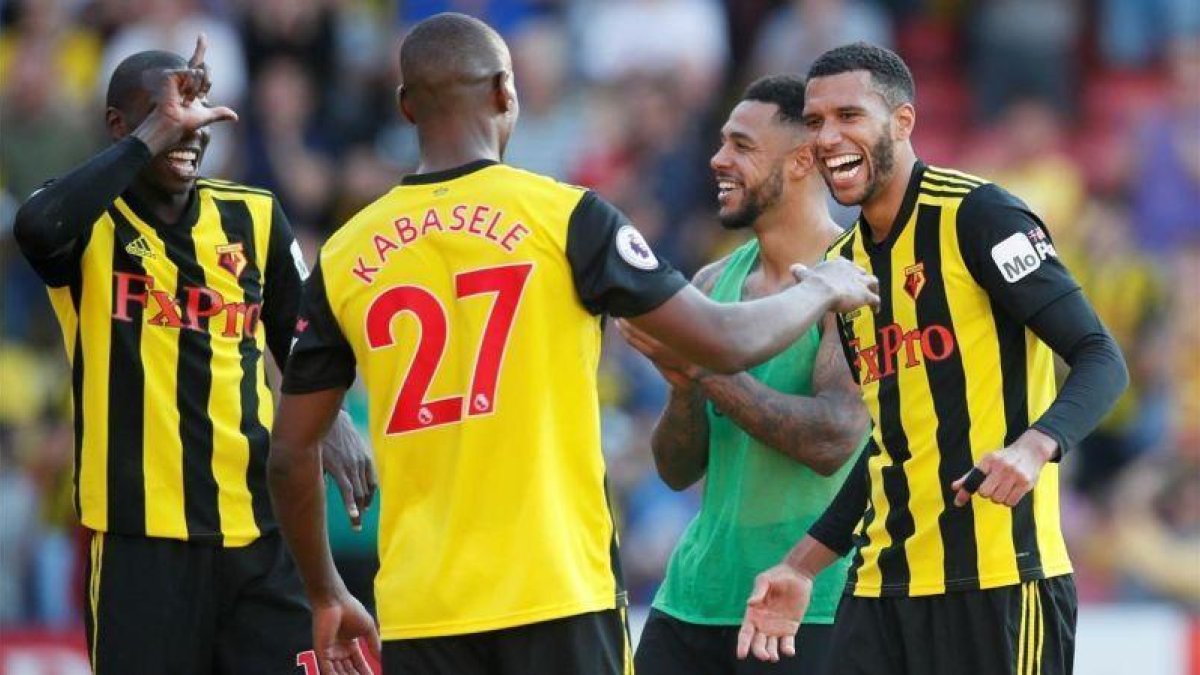 Los jugadores del Watford celebran uno de los dos goles anotados ante el Tottenham.-DAVID KLEIN