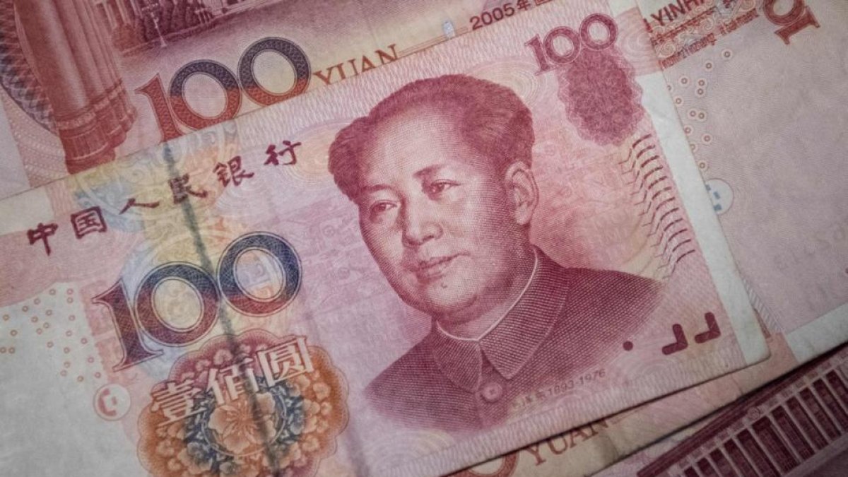 Un billete de 100 yuan.-FRED DUFOUR / AFP