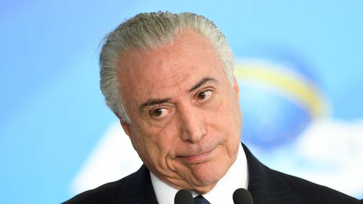 Las autoridades investigan si un decreto sancionado por Temer en 2017 y que alteró la ley de puertos benefició a algunas empresas del sector.-AFP