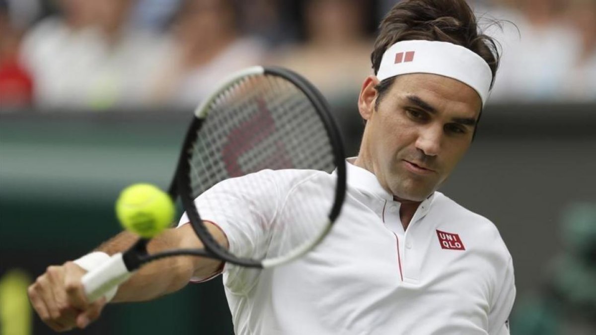 Federer en su partido ante Lacko-KIRSTY WIGGLESBOURGH