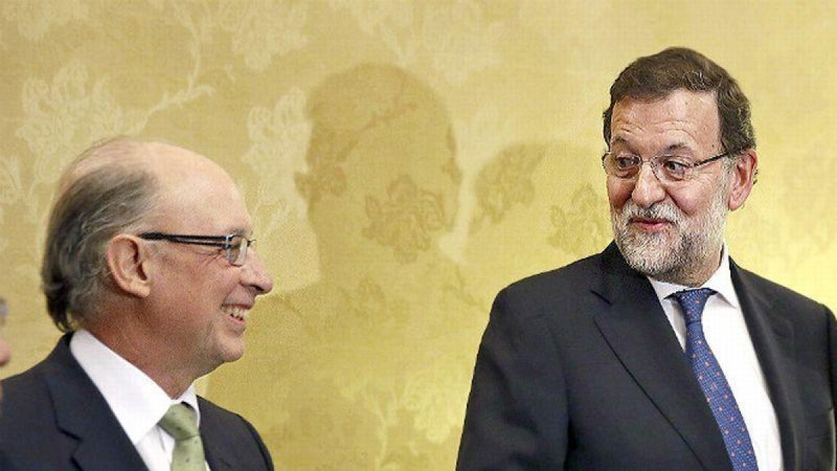 Montoro y Rajoy.-ARCHIVO / EFE